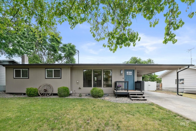 3513 7th St E, Lewiston, ID 83501 - view of front of property with concrete driveway, an attached carport, and a chimney
