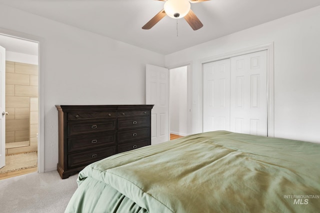 3513 7th St E, Lewiston, ID 83501 - bedroom with a closet, light carpet, connected bathroom, and a ceiling fan