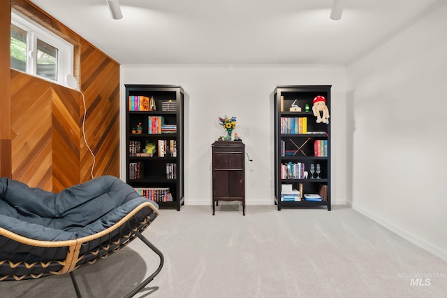 3513 7th St E, Lewiston, ID 83501 - living area featuring carpet flooring, crown molding, and wood walls
