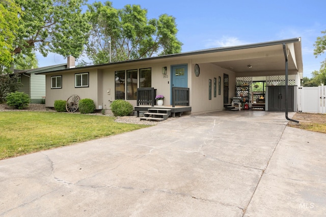 3513 7th St E, Lewiston, ID 83501 - view of front facade with a gate, an attached carport, and driveway