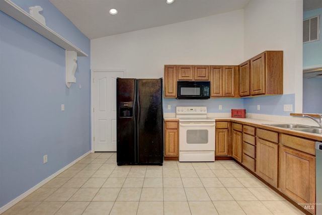 kitchen with black appliances, light tile patterned flooring, sink, and high vaulted ceiling