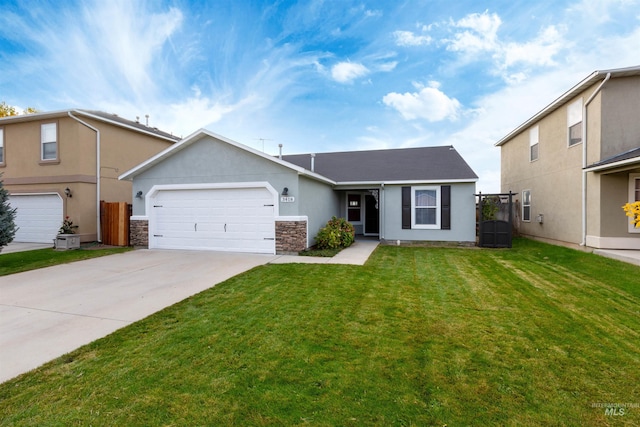 view of front of home with a garage and a front lawn