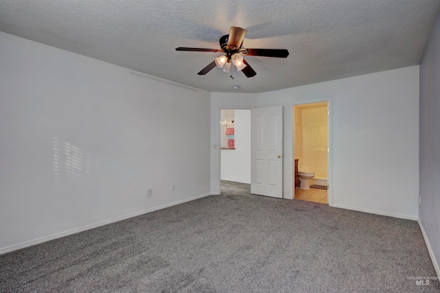 unfurnished bedroom featuring a textured ceiling, ceiling fan, light carpet, and ensuite bath