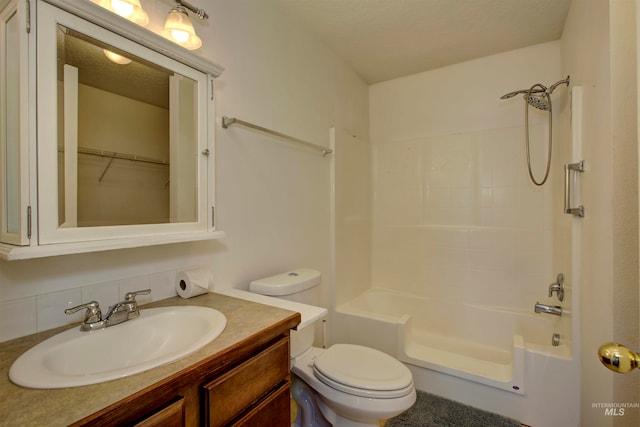 full bathroom with vanity,  shower combination, toilet, a textured ceiling, and tasteful backsplash