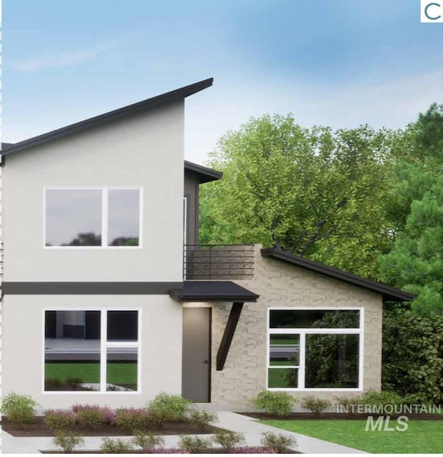 contemporary home with stucco siding