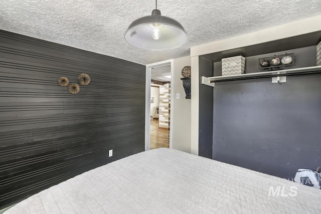 unfurnished bedroom with a textured ceiling