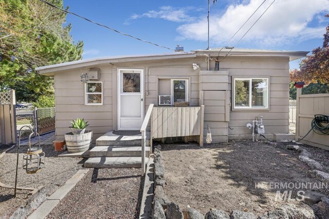 back of property with fence