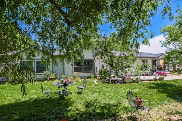 518 N 42nd, Nampa, ID 83687 - view of green lawn featuring a patio area