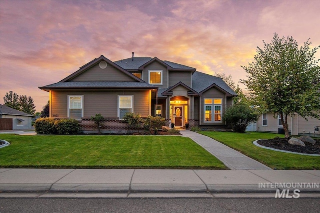 view of front of house with a yard