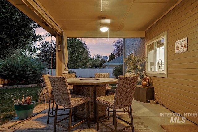 view of patio terrace at dusk