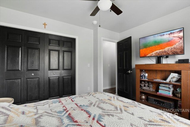 bedroom featuring a closet, ceiling fan, and hardwood / wood-style flooring