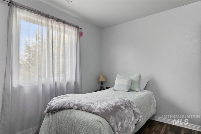 bedroom featuring dark hardwood / wood-style floors