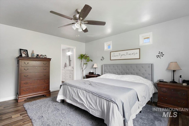 bedroom with dark hardwood / wood-style floors, ensuite bath, and ceiling fan