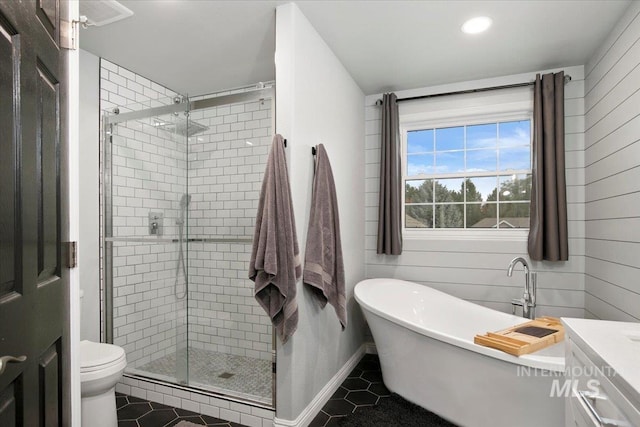 full bathroom with vanity, separate shower and tub, toilet, and tile patterned flooring