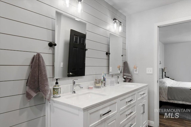 bathroom featuring vanity and hardwood / wood-style flooring