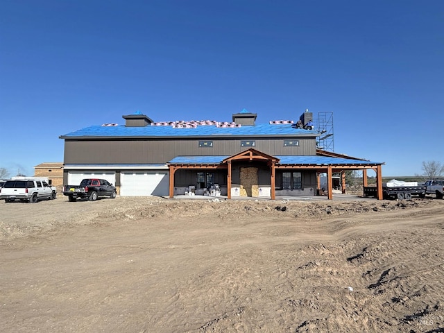view of front of property featuring driveway and an attached garage