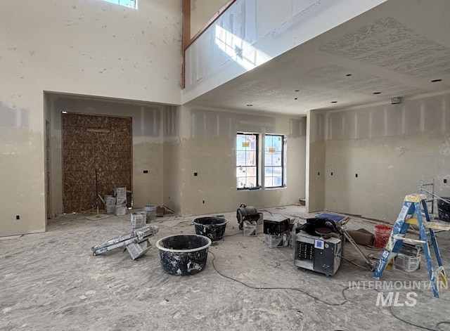 interior space featuring a towering ceiling