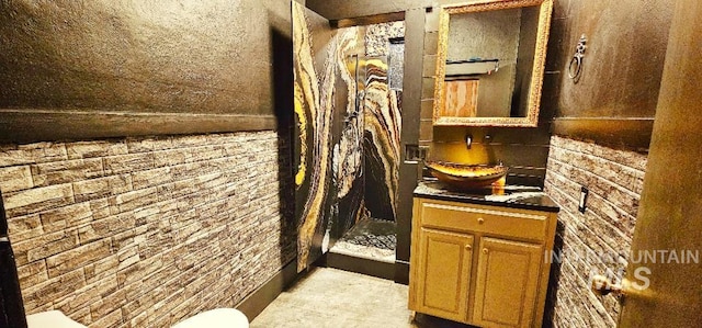 bathroom featuring vanity and a stall shower