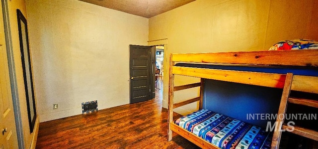 bedroom with wood finished floors