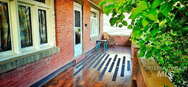 view of side of property with brick siding