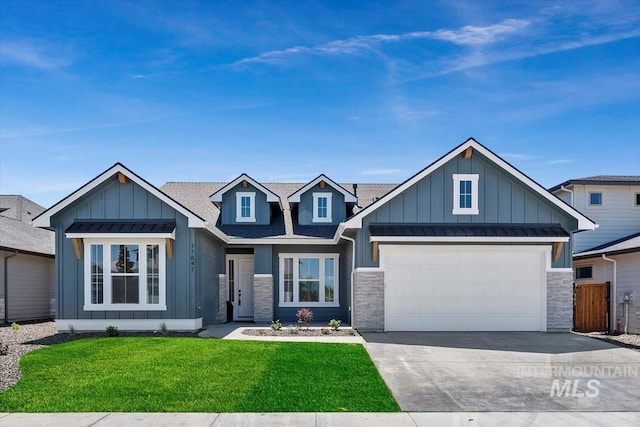 craftsman inspired home featuring a garage and a front lawn