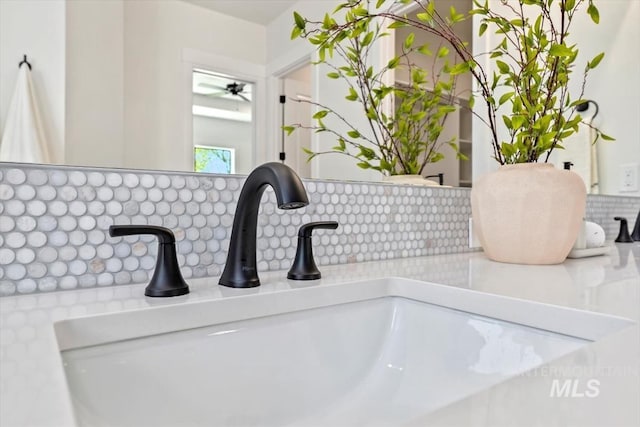 interior details with backsplash and sink