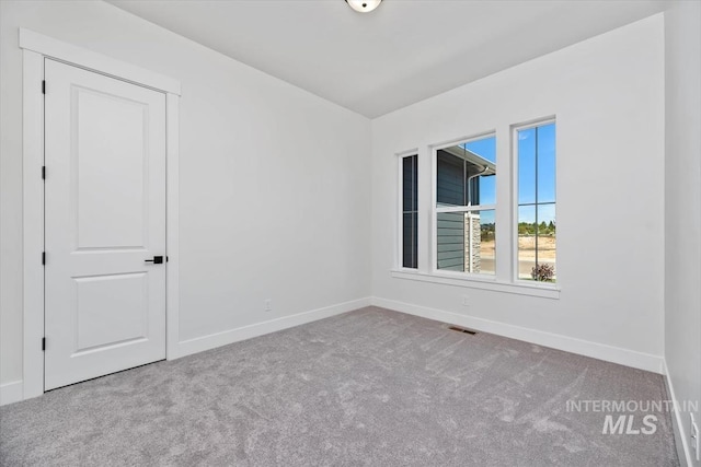 view of carpeted spare room