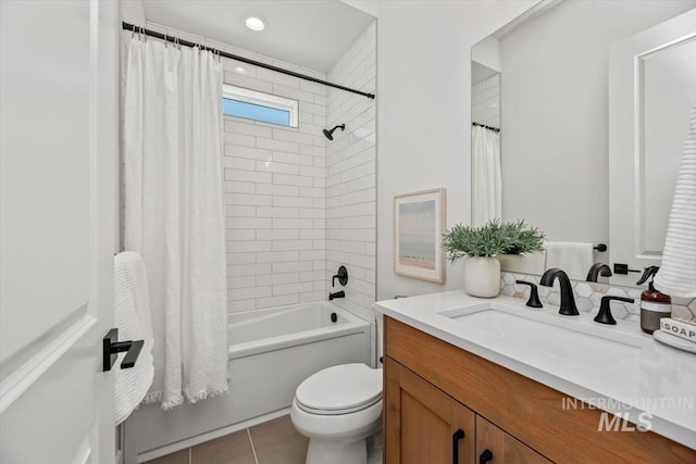 full bathroom with tile patterned flooring, vanity, toilet, and shower / tub combo