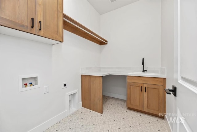 laundry area featuring hookup for an electric dryer, cabinets, sink, and washer hookup