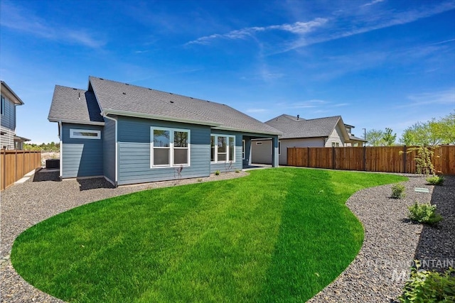 back of house featuring a yard