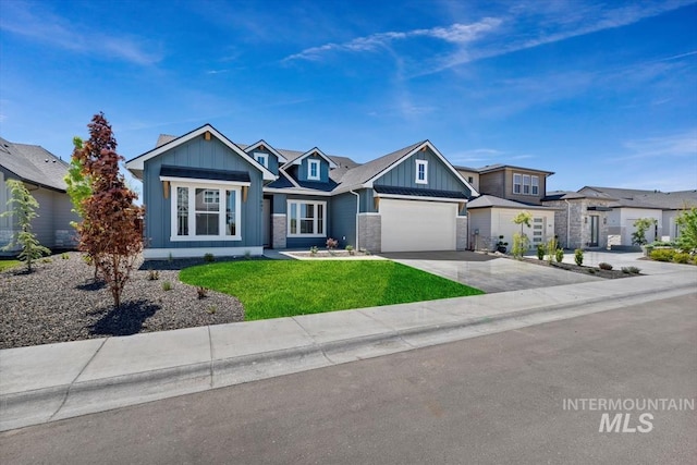 view of front of home featuring a garage and a front yard