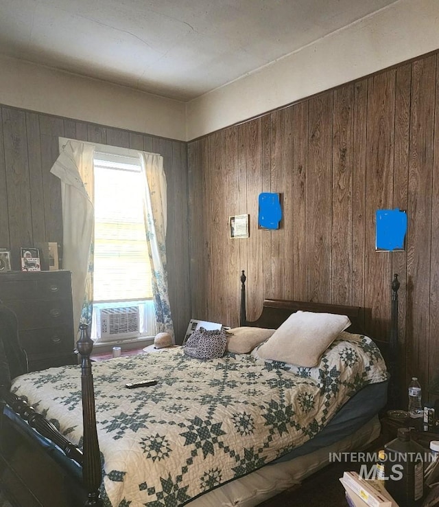 bedroom with cooling unit and wooden walls