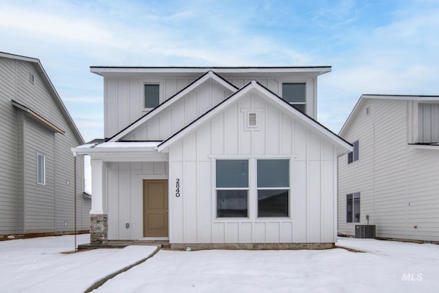 modern farmhouse style home with cooling unit