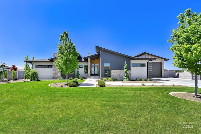 6553 S Pemberley Way, Meridian, ID 83642 - view of front of house with stone siding, concrete driveway, and an attached garage