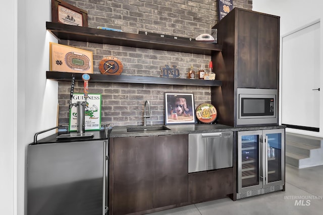 6553 S Pemberley Way, Meridian, ID 83642 - indoor wet bar with wine cooler, stainless steel microwave, and concrete floors