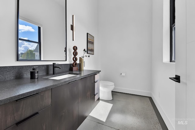 6553 S Pemberley Way, Meridian, ID 83642 - bathroom with toilet, vanity, and baseboards