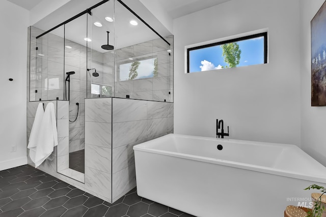 6553 S Pemberley Way, Meridian, ID 83642 - full bath featuring a soaking tub, a tile shower, recessed lighting, and tile patterned flooring