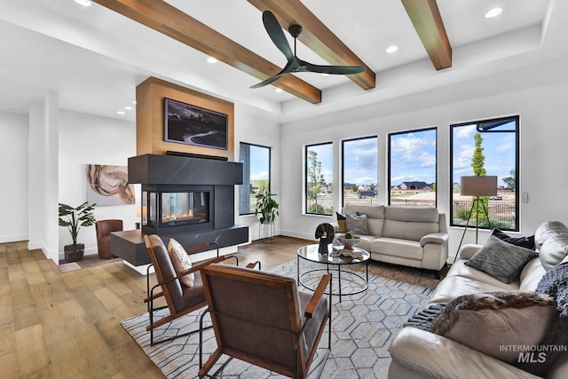 6553 S Pemberley Way, Meridian, ID 83642 - living room with wood-type flooring, a premium fireplace, healthy amount of natural light, beamed ceiling, and recessed lighting