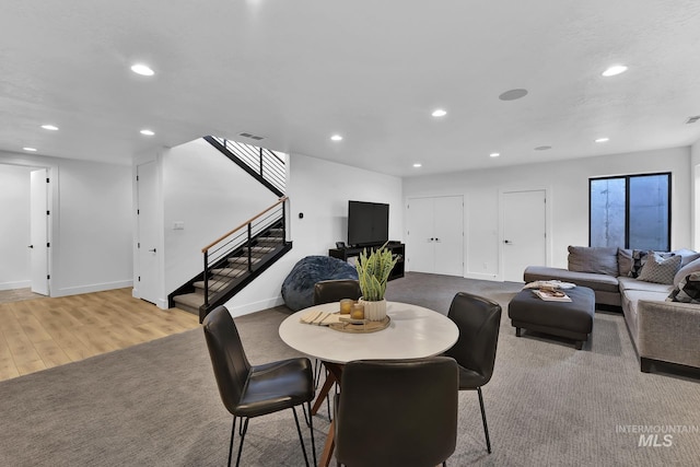 6553 S Pemberley Way, Meridian, ID 83642 - dining space with stairs, wood finished floors, recessed lighting, and baseboards