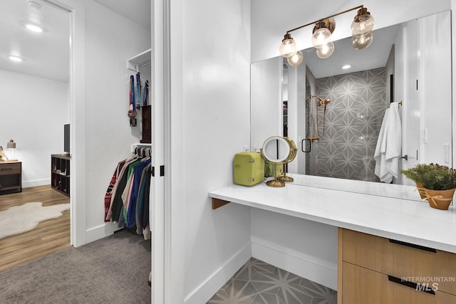 6553 S Pemberley Way, Meridian, ID 83642 - full bath featuring tiled shower, baseboards, a spacious closet, recessed lighting, and vanity