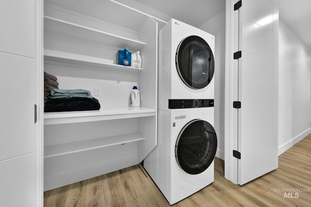 6553 S Pemberley Way, Meridian, ID 83642 - laundry room featuring stacked washer / drying machine and wood finished floors