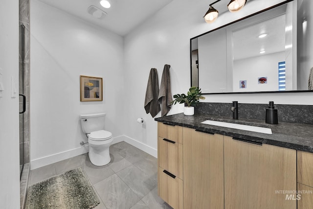 6553 S Pemberley Way, Meridian, ID 83642 - bathroom with vanity, baseboards, toilet, and a shower stall