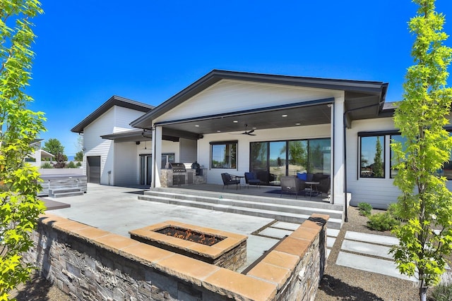 6553 S Pemberley Way, Meridian, ID 83642 - rear view of property with an outdoor living space with a fire pit, a patio, area for grilling, and a ceiling fan