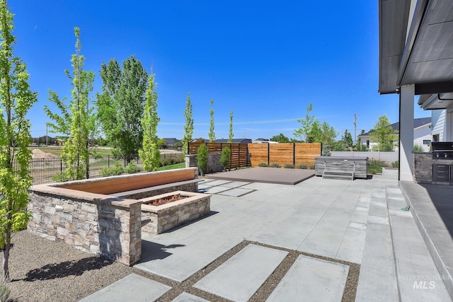 6553 S Pemberley Way, Meridian, ID 83642 - fenced backyard featuring a patio area and an outdoor fire pit