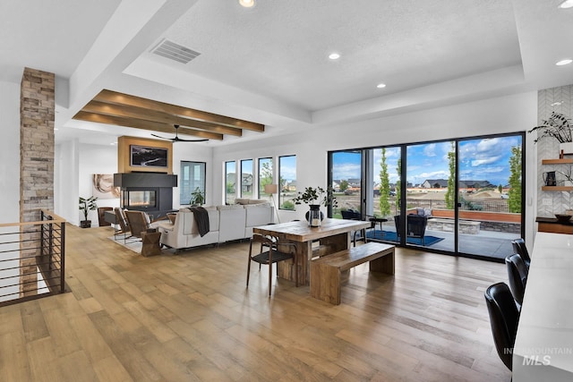 6553 S Pemberley Way, Meridian, ID 83642 - dining space with hardwood / wood-style flooring, ceiling fan, beam ceiling, recessed lighting, and a textured ceiling