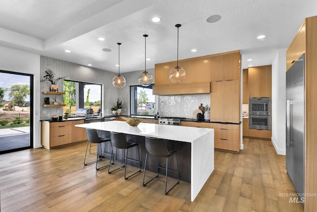 6553 S Pemberley Way, Meridian, ID 83642 - kitchen with modern cabinets, stainless steel appliances, a kitchen island, a kitchen bar, and open shelves