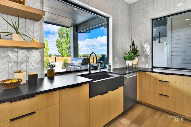 6553 S Pemberley Way, Meridian, ID 83642 - kitchen featuring wallpapered walls, open shelves, light wood-type flooring, dishwasher, and a sink