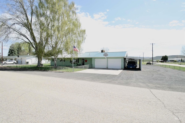 400 Somerville St, Jordan Valley, OR 97910 - single story home with fence, a garage, driveway, and metal roof