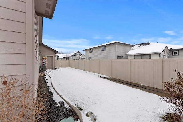 view of yard layered in snow