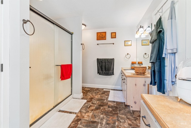 bathroom featuring vanity and an enclosed shower